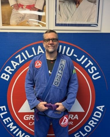 Coach Erik, purple belt Brazilian Jiu-Jitsu coach at Gracie Barra Fleming Island FL